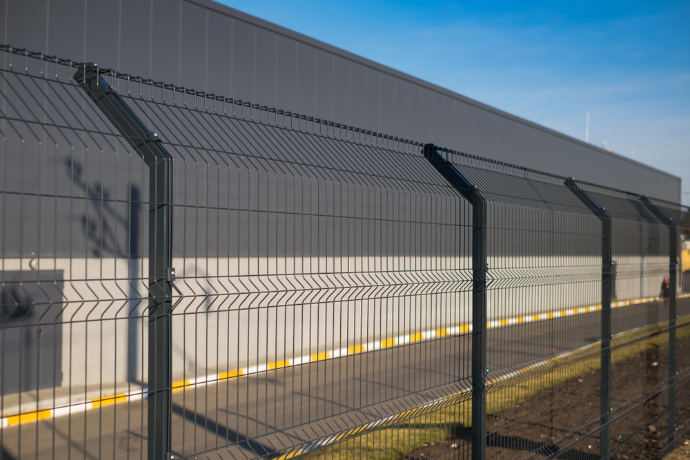 Black Perimeter Security Fencing with a building in the background